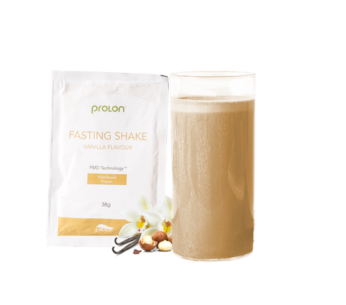 ProLon Fasting Shake vanilla flavor plant-based protein with glass of shake and vanilla flowers
